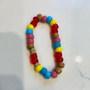 Plated 18 kt barrel and glass rainbow beads Elastic Bracelet